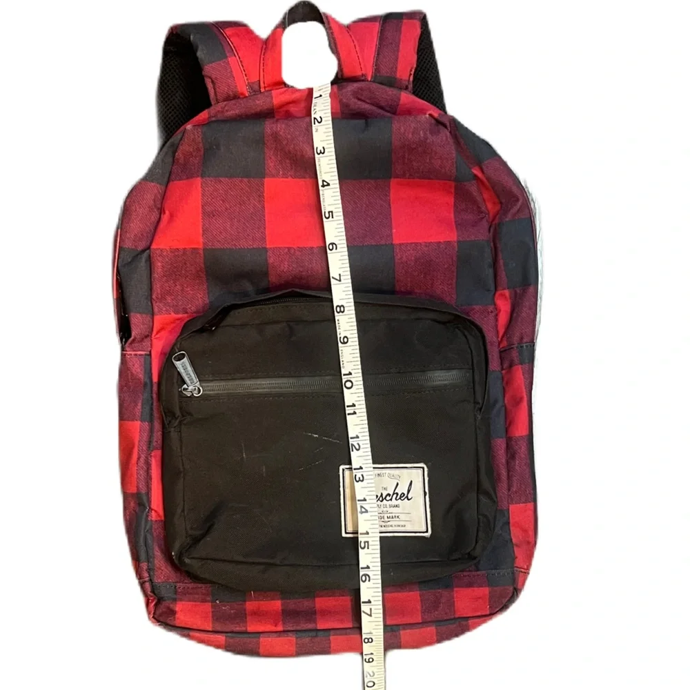 Herschel Supply Co. Pop Quiz backpack in a red and black buffalo plaid pattern.